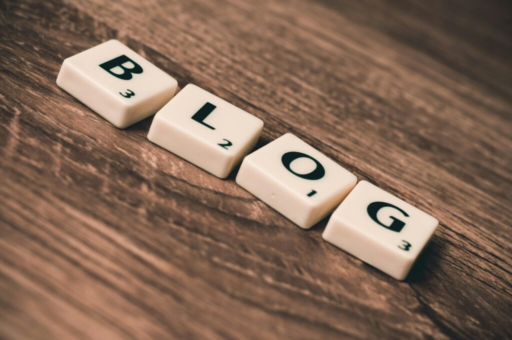 "Blog" spelled out in scrabble letters, referring to the blogging needed for SEO